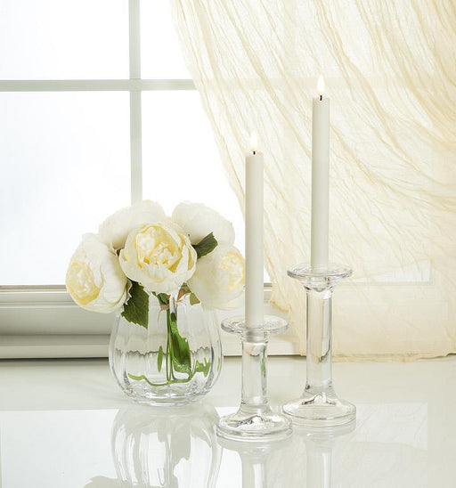 Luxlite Sand LED taper candles displayed in glass holders on a dining table