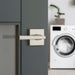 Modern laundry room door featuring a Weiser Montreal Satin Nickel lever handle.