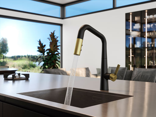 Pfister Asari 1-Handle Pull-Down Kitchen Faucet in matte black with brushed gold accents installed over a modern kitchen sink with running water