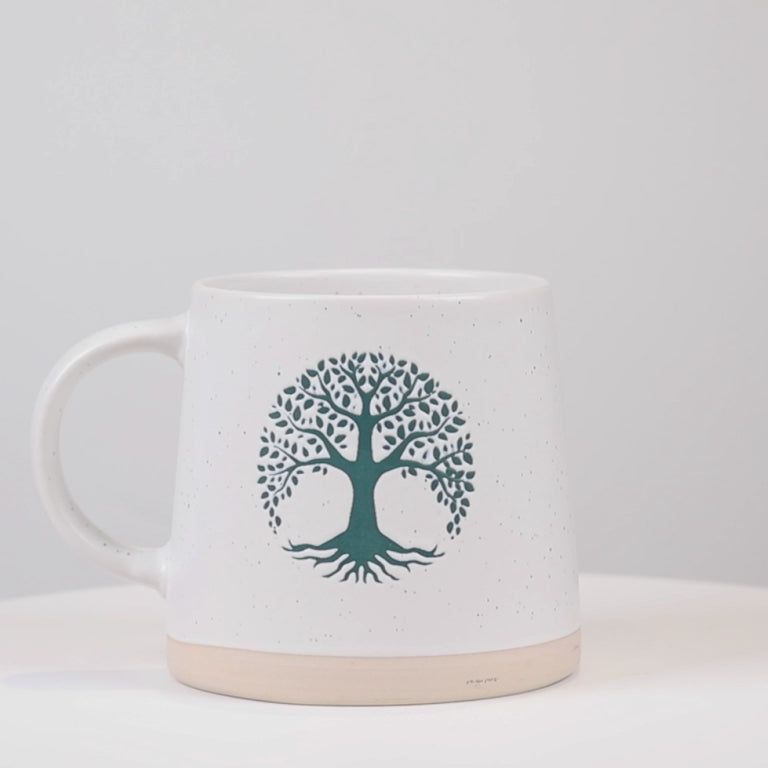 Video showing the ivory and green Tree of Life stoneware mug from multiple angles