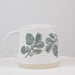 Video showing the Abbott pinecone stoneware mug from multiple angles