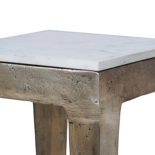 Close-up detail of Renwil Abby natural white marble tabletop and antique brass finish