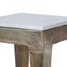 Close-up detail of Renwil Abby natural white marble tabletop and antique brass finish