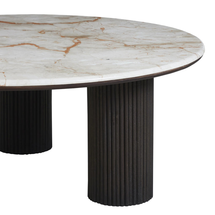 Side view of the Alessio marble coffee table with fluted mango wood legs