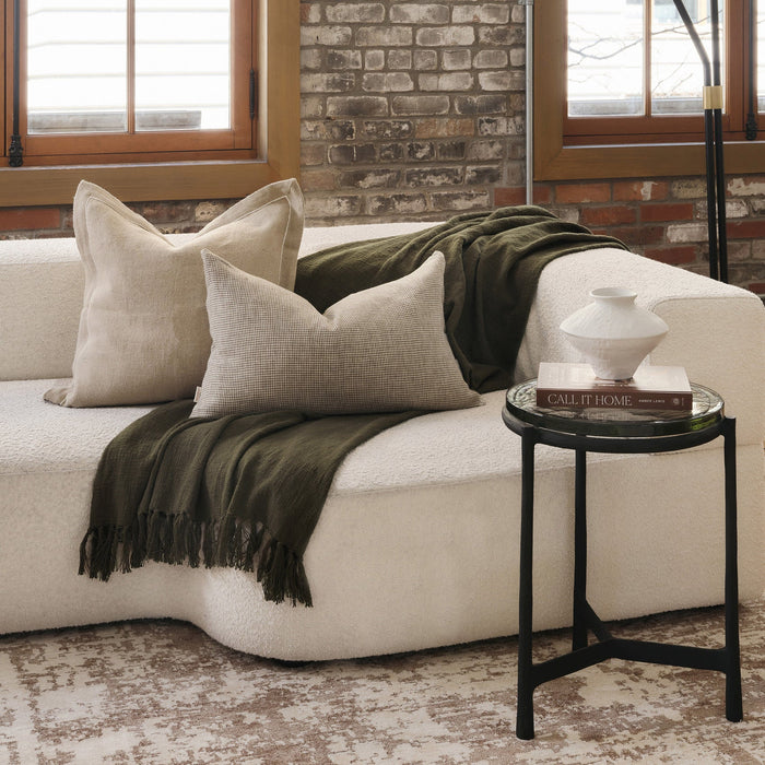 Renwil Avila black glass accent table styled in a cozy modern bedroom interior