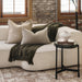 Renwil Avila black glass accent table styled in a cozy modern bedroom interior