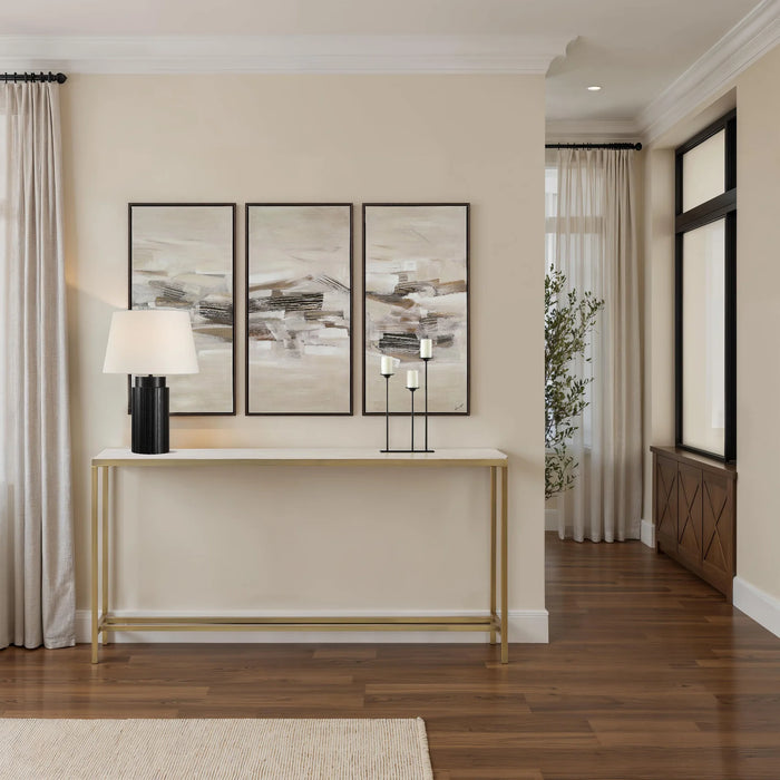 Renwil Bodin console table styled in a modern entryway with wall art and decorative accents