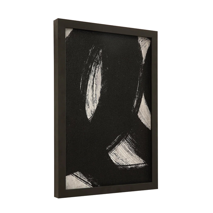 Angled view of black and white Carife abstract print in a black frame