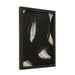 Angled view of black and white Carife abstract print in a black frame