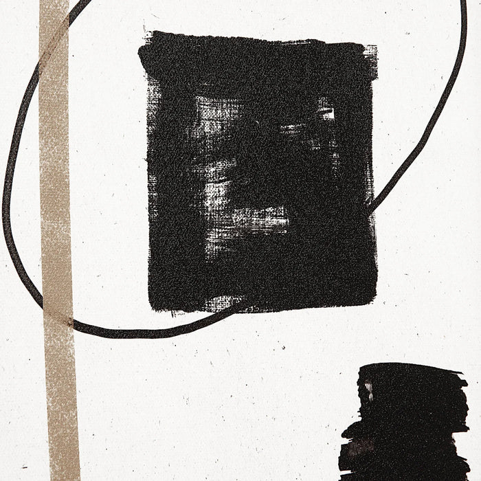 Close-up of black and gold brushwork on a Carife framed abstract print