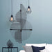 Renwil Chanel black geometric metal wall art displayed vertically in a contemporary bedroom