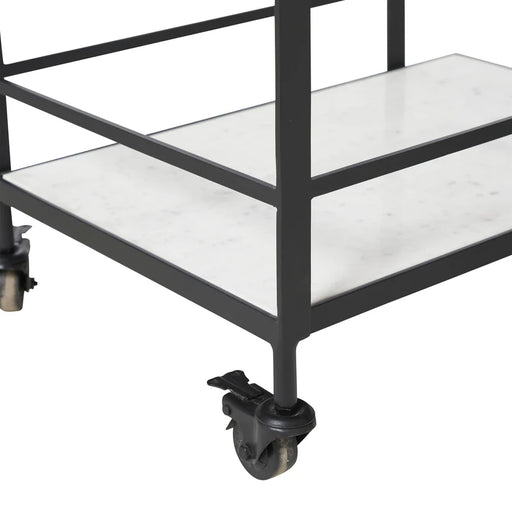 Close-up detail of marble shelving and caster wheels on Renwil Colton bar cart