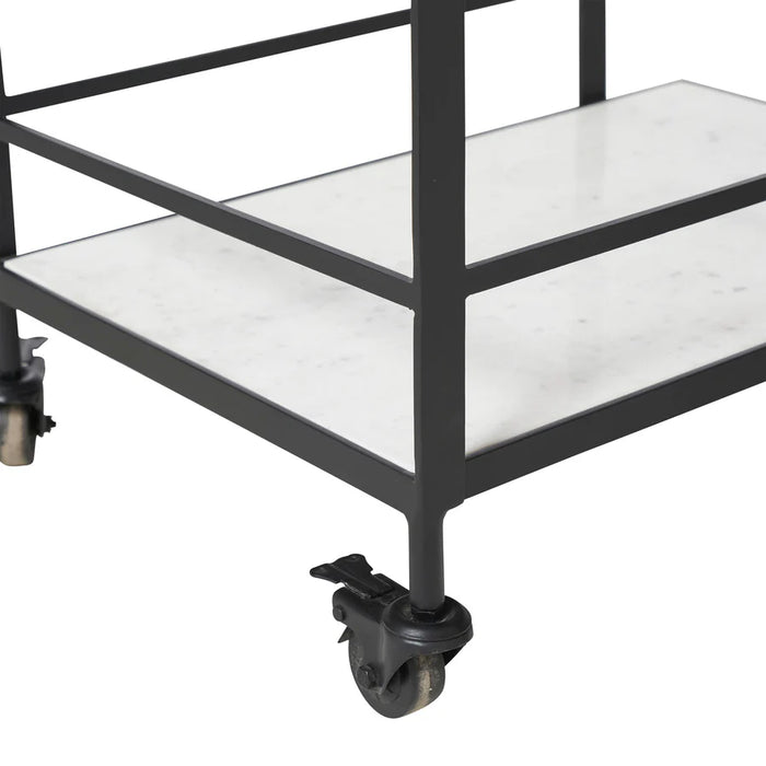 Close-up detail of marble shelving and caster wheels on Renwil Colton bar cart