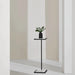 Renwil Danica marble side table styled beside a chair in a modern interior