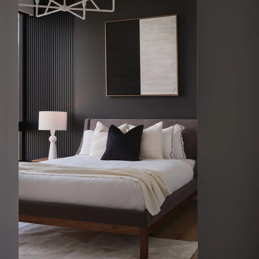 Renwil Gobi black and white canvas art displayed vertically in a modern bedroom