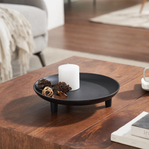 Renwil Kaleido black decorative tray styled with candles on a wooden coffee table