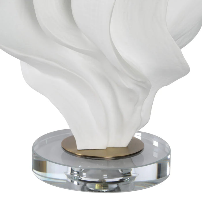 Close-up of the matte white resin body and clear crystal base on the Renwil Kombu lamp