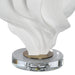 Close-up of the matte white resin body and clear crystal base on the Renwil Kombu lamp