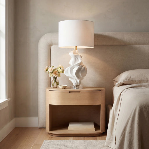 Renwil Kombu sculptural white table lamp displayed on a bedside table