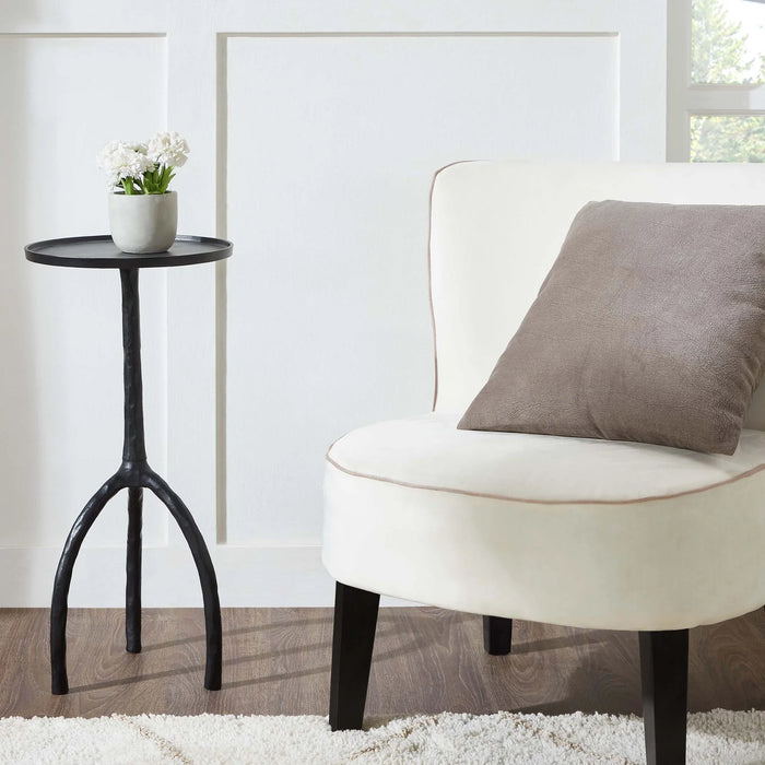 Renwil Konsta accent table styled beside a lounge chair in a modern living room