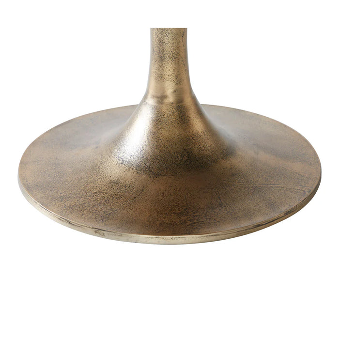 Detailed view of the antique brass pedestal base on the Renwil Lovisa coffee table