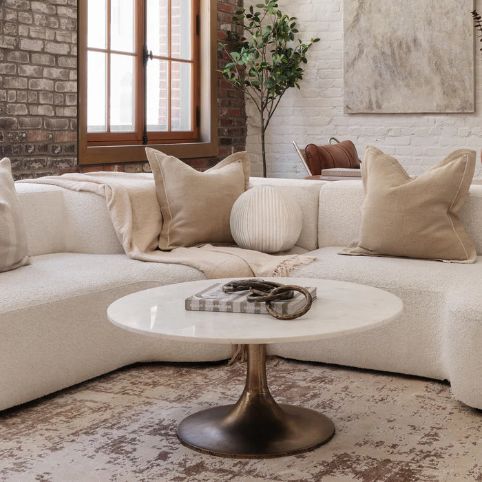 Renwil Lovisa round marble coffee table styled in a luxury living room with neutral décor