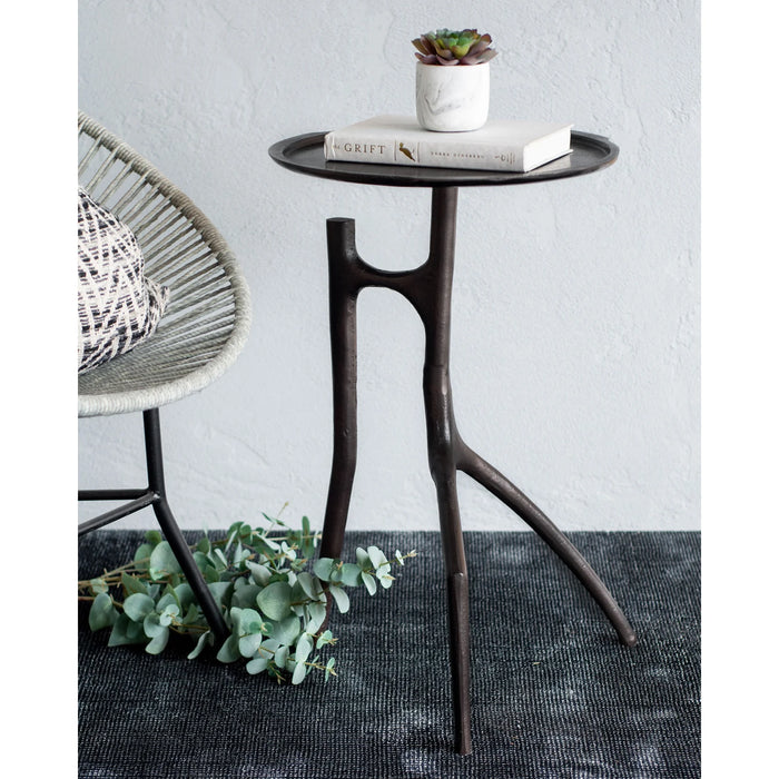 Renwil Maadi accent table styled beside a lounge chair in a modern interior