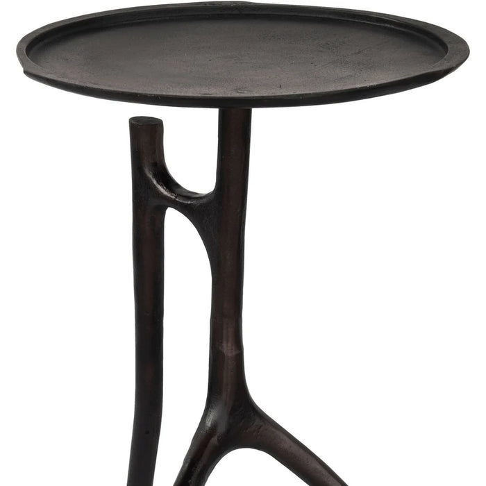 Renwil Maadi accent table styled beside a lounge chair in a modern interior