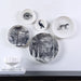 Renwil Maliya decorative porcelain wall plates displayed above a modern console table