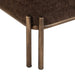 Close-up of the Meline ottoman stool painted brass iron base