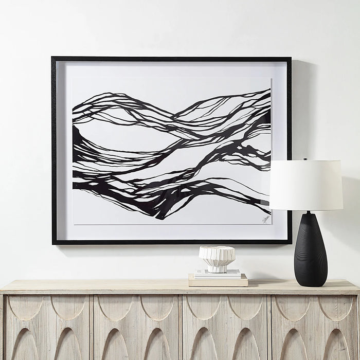 Renwil Mica black and white abstract wall art displayed above a contemporary console table
