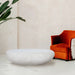 Renwil Minda natural white stone bench styled as a coffee table in a modern living room