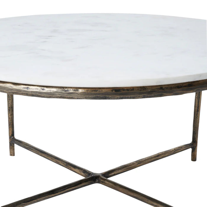 Detailed view of the antique brass cross-frame base on the Renwil Pearse coffee table