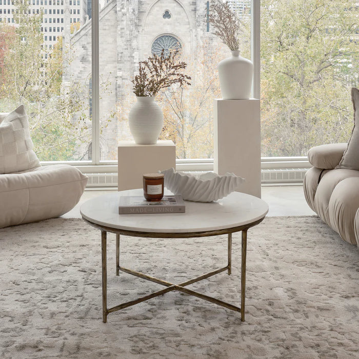 Renwil Pearse coffee table placed in a bright modern living room with soft natural lighting