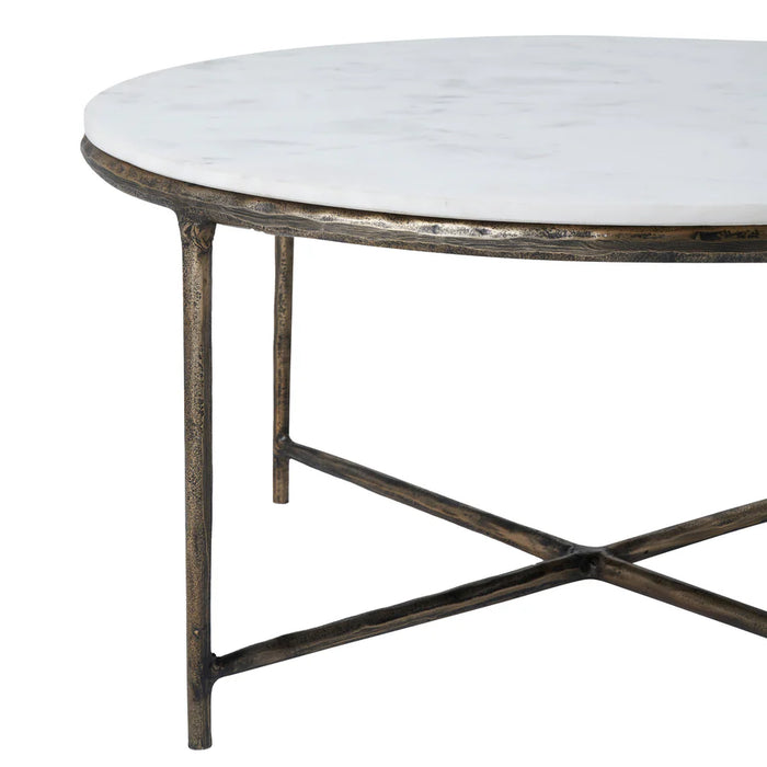 Side profile of the Renwil Pearse round coffee table with antique brass legs