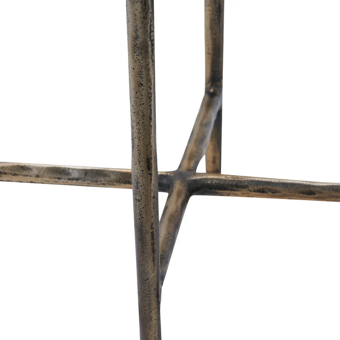 Close-up detail of antique brass crossed base on Renwil Pearson marble accent table