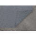 Corner of the Renwil rug underpad lifted to show its placement on flooring