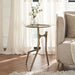 Renwil Tosca brass side table styled beside a sofa in a modern living room