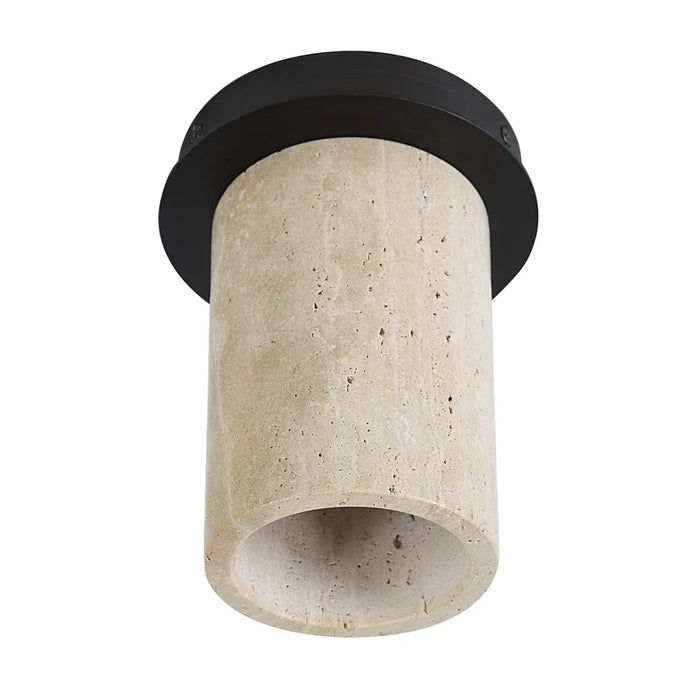 Angled view of the Umberto natural travertine flush-mount light