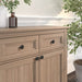 Richelieu 2056 cabinet knob set of 2 installed on wood cabinetry in black finish
