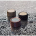 Richelieu 2065 cabinet knob collection shown in multiple finishes on stone surface