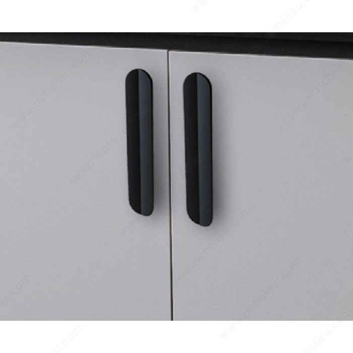 Richelieu 2585 sculpted cabinet pull installed on modern cabinet doors