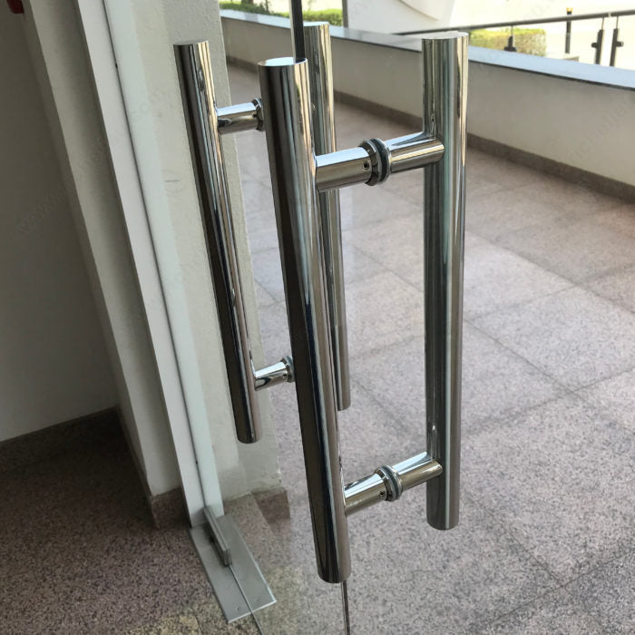 Richelieu 32 mm back-to-back ladder pull installed on an interior commercial glass door