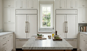 Richelieu 765 transitional metal appliance pulls installed in a bright kitchen setting