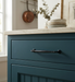 Richelieu 790 traditional metal pull in matte black installed on a blue vanity drawer