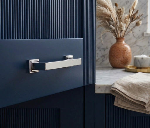 Richelieu 8645 transitional metal cabinet pull in chrome installed on a blue cabinet