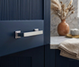 Richelieu 8645 transitional metal cabinet pull in chrome installed on a blue cabinet