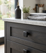 Richelieu 8655 matte black square cabinet knob installed on dark wood drawer