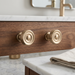 Richelieu 8725 champagne bronze cabinet knob set of 2 installed on wood vanity drawer