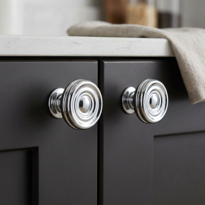 Richelieu 8725 chrome cabinet knob set of 2 installed on dark cabinet doors